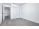 Bedroom featuring closet, carpet, a connecting door to another room, and neutral decor at 16395 Bird Of Paradise Ave, Clermont, FL 34714