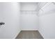Walk-in closet with neutral-toned carpet and wire shelving at 16395 Bird Of Paradise Ave, Clermont, FL 34714
