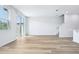 Bright, open living area with stylish wood floors and natural light at 16395 Bird Of Paradise Ave, Clermont, FL 34714