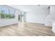 Bright, open living area featuring stylish wood floors and natural light at 16395 Bird Of Paradise Ave, Clermont, FL 34714