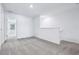 Carpeted loft space with a railing overlooking the stairs, offering an open, airy feel at 16395 Bird Of Paradise Ave, Clermont, FL 34714