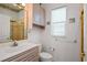 Cozy bathroom featuring one sink, a toilet, and a glass enclosed shower at 1640 N Atlantic Ave, New Smyrna Beach, FL 32169