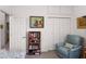 Cozy bedroom featuring a bookcase, accent chair and built-in storage at 1640 N Atlantic Ave, New Smyrna Beach, FL 32169