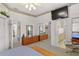 Bright bedroom with a flat-screen TV, and large dresser with a mirror above it at 1640 N Atlantic Ave, New Smyrna Beach, FL 32169