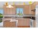 Spacious kitchen with granite countertops, updated appliances and ample storage at 1640 N Atlantic Ave, New Smyrna Beach, FL 32169