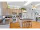 Bright kitchen with center island, modern appliances and hardwood floors at 1640 N Atlantic Ave, New Smyrna Beach, FL 32169