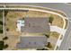 An aerial view showcases the home's backyard patio and the surrounding neighborhood street layout at 17500 Butterfly Pea Ct, Clermont, FL 34714