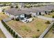 Backyard view highlights the outdoor living space, patio with seating, and well-maintained lawn at 17500 Butterfly Pea Ct, Clermont, FL 34714