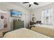 Charming bedroom featuring two twin beds and unique vintage decor and bright natural lighting at 17500 Butterfly Pea Ct, Clermont, FL 34714