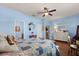 A bright and cheerful bedroom with a ceiling fan and an ensuite bathroom at 17500 Butterfly Pea Ct, Clermont, FL 34714
