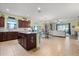 Spacious kitchen featuring an island, stainless steel appliances, and an open layout to the living space at 17500 Butterfly Pea Ct, Clermont, FL 34714