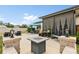 Large patio with fire pit, outdoor seating, and a screened-in porch at 17500 Butterfly Pea Ct, Clermont, FL 34714