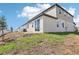 Exterior view of a home with a patio, sliding doors, and manicured lawn at 1805 Archer Dr, Minneola, FL 34715