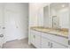 Bathroom features double sink with granite countertop and tiled floor at 1805 Archer Dr, Minneola, FL 34715