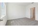 Bedroom with neutral carpet, natural light, and ensuite bathroom at 1805 Archer Dr, Minneola, FL 34715
