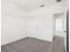 Bedroom showcasing a neutral color palette, carpet, and a doorway leading to another room at 1805 Archer Dr, Minneola, FL 34715