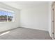 Bedroom with neutral carpet, natural light, and ensuite bathroom at 1805 Archer Dr, Minneola, FL 34715