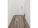 Inviting hallway features wood-look floors leading to the front door, creating a warm and welcoming entrance at 1805 Archer Dr, Minneola, FL 34715