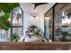 Cozy outdoor balcony with seating, ceiling fan, sliding glass doors and lovely plants at 200 Carolina Ave # 201, Winter Park, FL 32789