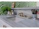 Stylish bathroom counter featuring marble countertops, a vessel sink, gold fixtures, and attractive decor at 200 Carolina Ave # 201, Winter Park, FL 32789