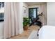 Bright bedroom with hardwood floors, sliding glass door, a stationary bike, and natural light at 200 Carolina Ave # 201, Winter Park, FL 32789