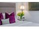 Comfortable bedroom featuring stylish accents, a decorative pillow, bedside table, and elegant decor at 200 Carolina Ave # 201, Winter Park, FL 32789
