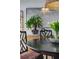 Dining room with a dark wood table, uniquely patterned chairs, and natural light at 200 Carolina Ave # 201, Winter Park, FL 32789