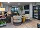 Chic living room with modern decor, plush seating, fireplace, and stylish furnishings at 200 Carolina Ave # 201, Winter Park, FL 32789
