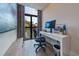 Well-lit office space with a modern desk, large monitor, and stylish decor, perfect for a productive work environment at 200 Carolina Ave # 201, Winter Park, FL 32789
