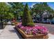 Charming street with colorful flower beds, mature trees, and sidewalks, creating a welcoming atmosphere at 200 Carolina Ave # 201, Winter Park, FL 32789