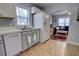 Well-equipped kitchen with white appliances, tile countertops, and open layout to the living area at 200 W 27Th St, Sanford, FL 32773
