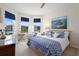 Sunlit bedroom featuring large windows and stylish decor with a beachy theme at 2003 Spring Shower Cir, Kissimmee, FL 34744