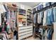 Organized walk-in closet featuring built-in shelving and rods for ample storage at 2003 Spring Shower Cir, Kissimmee, FL 34744