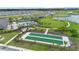 Aerial view showcasing community amenities including pool, bocce ball, and clubhouse at 2003 Spring Shower Cir, Kissimmee, FL 34744