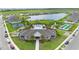 Aerial view of community with lake, pool, tennis, bocce ball, and clubhouse at 2003 Spring Shower Cir, Kissimmee, FL 34744