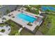 Aerial view of a luxurious community pool with ample seating and lush landscaping at 2003 Spring Shower Cir, Kissimmee, FL 34744