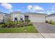 A well maintained home with a beautiful front garden and brick paver driveway at 2003 Spring Shower Cir, Kissimmee, FL 34744