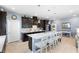 Well designed kitchen island, dark-wood cabinets and stainless steel appliances at 2003 Spring Shower Cir, Kissimmee, FL 34744