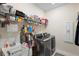 Well-equipped laundry room featuring modern appliances and ample storage space at 2003 Spring Shower Cir, Kissimmee, FL 34744