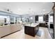 Open-concept living space that combines kitchen, dining, and living room areas at 2003 Spring Shower Cir, Kissimmee, FL 34744
