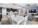 Open concept living space featuring a dining area, kitchen, and living room with a fireplace at 2003 Spring Shower Cir, Kissimmee, FL 34744
