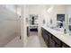 Elegant main bathroom featuring a walk-in shower, double vanity, and view into the bedroom at 2003 Spring Shower Cir, Kissimmee, FL 34744