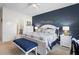 Comfortable main bedroom featuring king bed, walk-in closet, and en-suite bathroom at 2003 Spring Shower Cir, Kissimmee, FL 34744