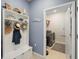 Hall tree in mud room leads to laundry room with washer and dryer at 2003 Spring Shower Cir, Kissimmee, FL 34744