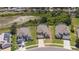Overhead view of multiple single-Gathering homes with green lawns in a residential neighborhood at 2655 Star Lake View Dr, Kissimmee, FL 34747