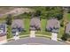 Bird's eye view of houses in a residential area with manicured lawns and tree coverage at 2655 Star Lake View Dr, Kissimmee, FL 34747