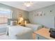 This bedroom featuring two twin beds, soft decor, and ample space at 2655 Star Lake View Dr, Kissimmee, FL 34747