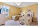 Bright bedroom featuring two twin beds, soft decor, and ample space at 2655 Star Lake View Dr, Kissimmee, FL 34747