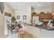 Cozy dining area with a breakfast bar and natural light from the window at 2655 Star Lake View Dr, Kissimmee, FL 34747