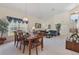 Inviting dining area with open access to living area, neutral tones, and natural light at 2655 Star Lake View Dr, Kissimmee, FL 34747